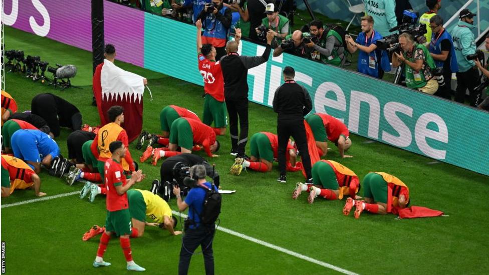 Morocco players prostrated in celebration at full-time