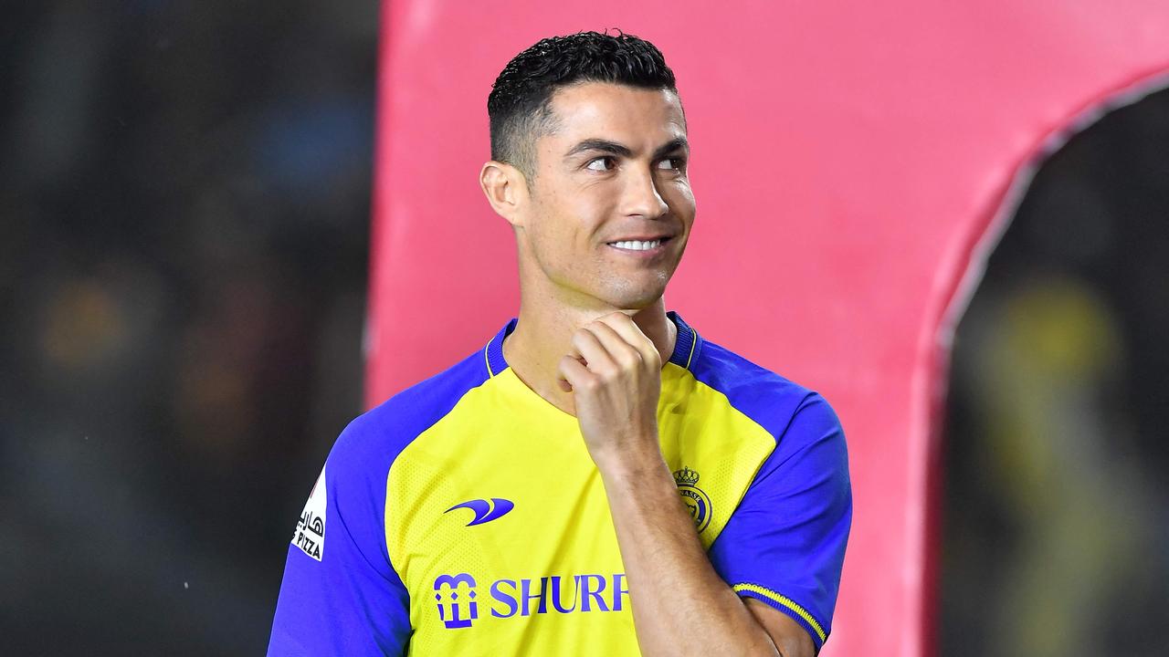 Al-Nassr's new Portuguese forward Cristiano Ronaldo greets the fans during his unveiling at the Mrsool Park Stadium in the Saudi capital Riyadh on January 3, 2023. (Photo by AFP)