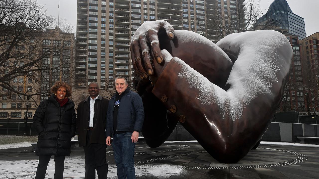 Reverend Liz Walker, Reverend Jeffrey Brown and Paul English stand in front of the MLK memorial they helped to bring to Boston. (Photo by Lane Turner/The Boston Globe via Getty Images)