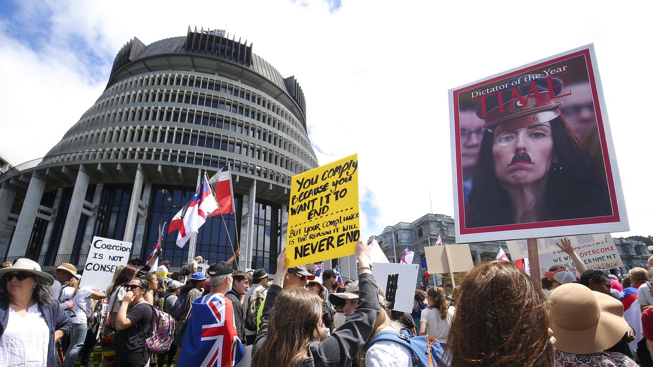 A protester holds a sign displaying the image of Prime Minister Jacinda Ardern during a Freedom and Rights Coalition protest at Parliament in November, 2021. Picture: Hagen Hopkins/Getty Images
