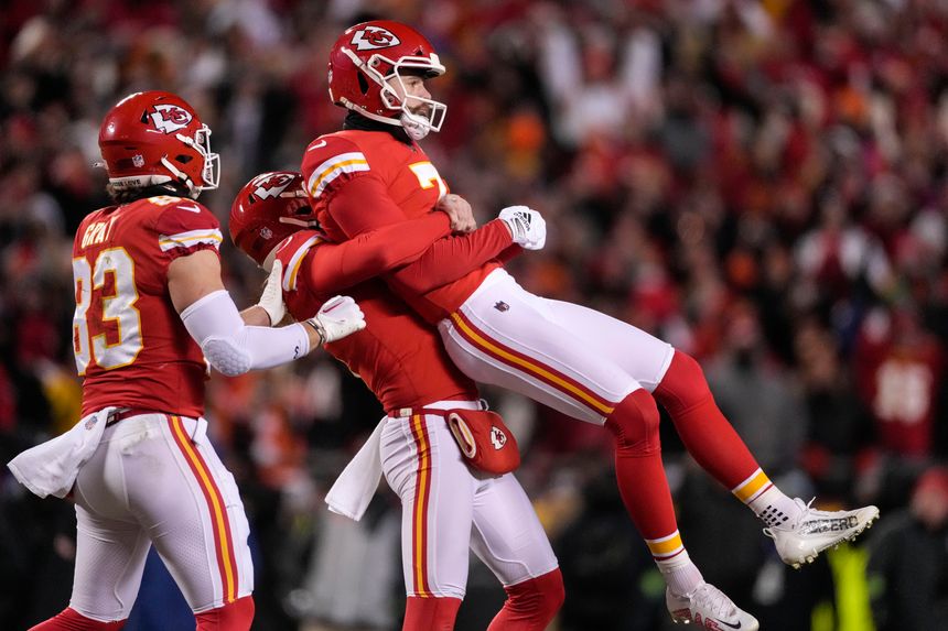 Kansas City Chiefs kicker Harrison Butker is lifted in the air after his game-winning field goal. PHOTO: JEFF ROBERSON/ASSOCIATED PRESS