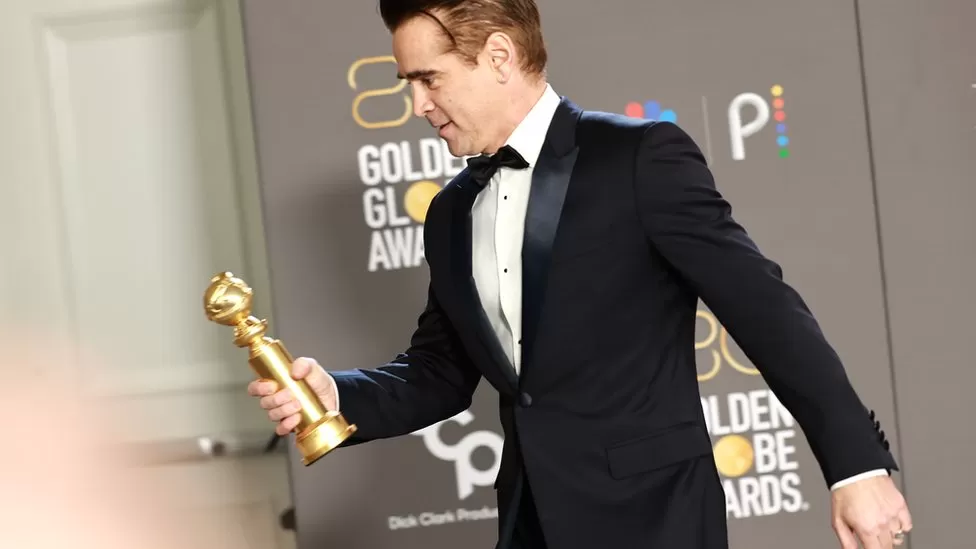 GETTY IMAGES / Collin Farrell appears at the 80th annual Golden Globe Awards. Days later, he misses the Critics Choice Awards due to Covid-19