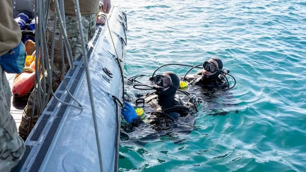 US NAVY  / Navy divers helped recover the balloon from the Atlantic Ocean