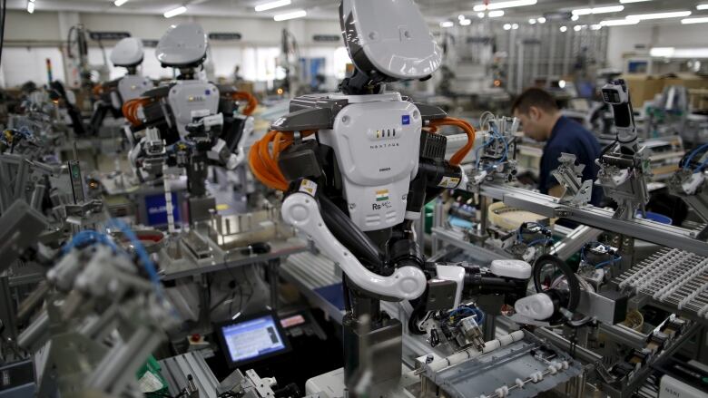 We know businesses own the robotic factory workers, but as AI software like ChatGPT shows that it is capable of mental work, shareholders are rushing to own the brains as well. (Issei Kato/Reuters)