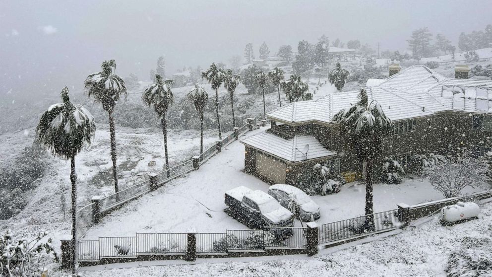 Snow blankets a home in Rancho Cucamonga, Calif., on Feb. 25, 2023. Josh Edelson/AFP via Getty Images