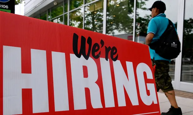 The US currently has nearly 11m job openings – close to two vacancies for every unemployed American. Photograph: Olivier Douliery/AFP/Getty Images
