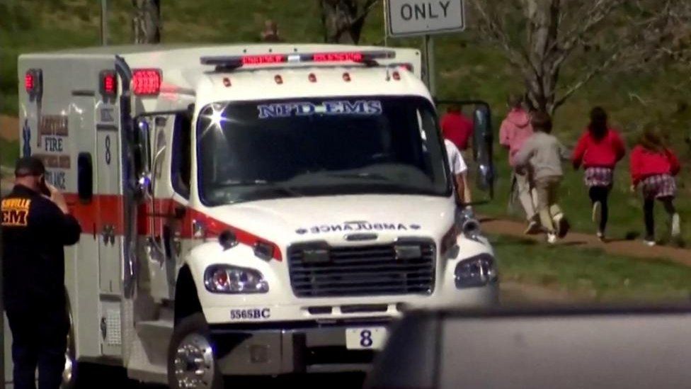 NEWSNATION/REUTERS An ambulance stands near Nashville's Covenant School as children are escorted away