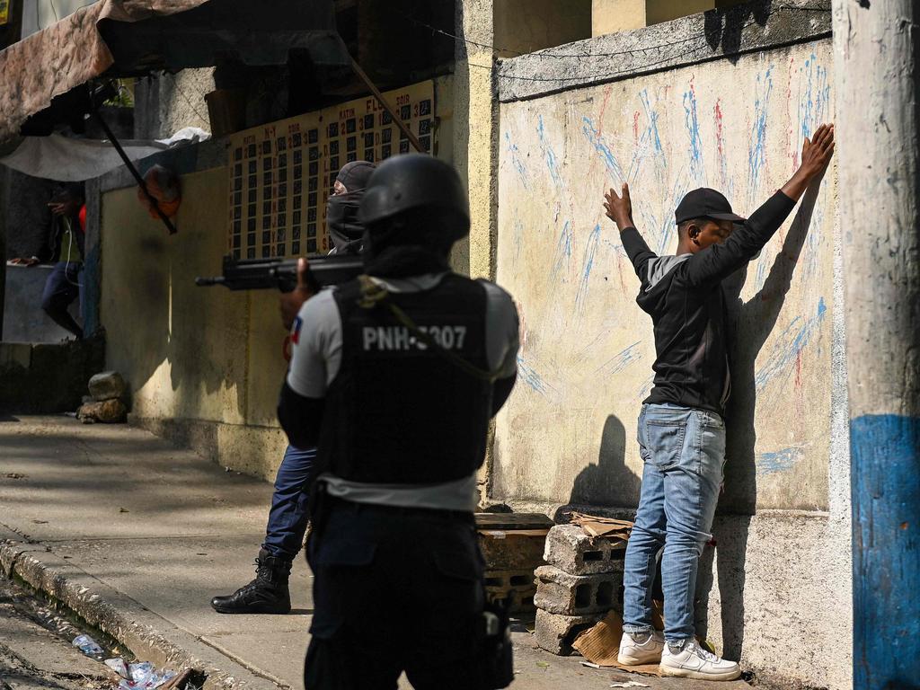 Haitian police arrest a main in the Turgeau commune. Picture: Richard Pierrin/AFP