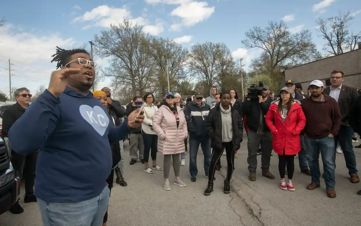 Thea Davis, pastor at Restore Community Church, addresses a crowd of protestors before a march in Kansas City over the shooting of Ralph Yarl. Photograph: Susan Pfannmuller/AP