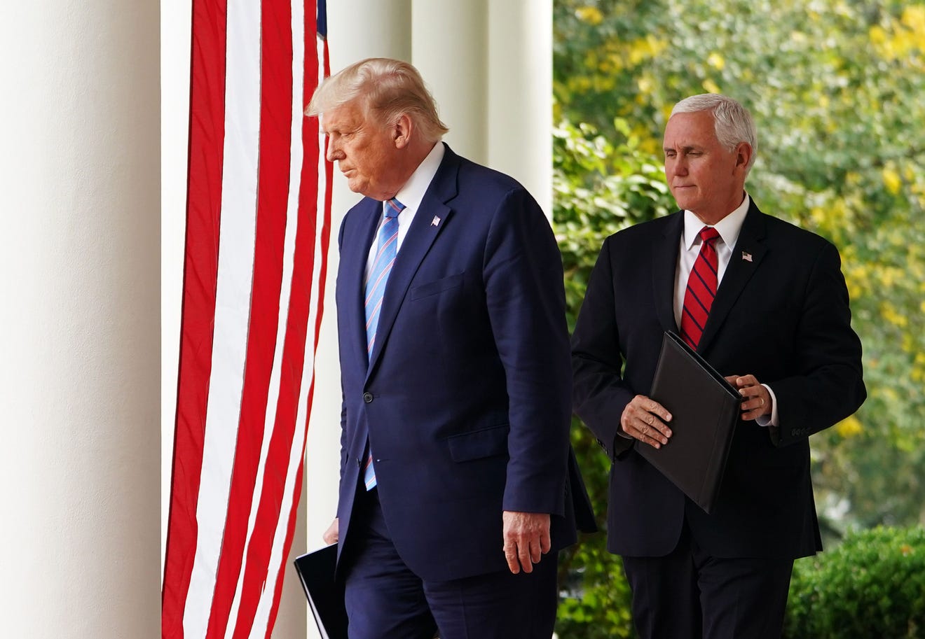 n this file photo taken on September 28, 2020, US President Donald Trump and Vice President Mike Pence arrive in the Rose Garden to speak on Covid-19 testing at the White House in Washington, DC.