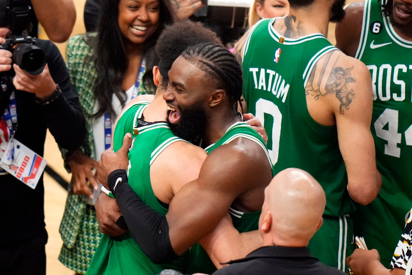 Celtics guards Derrick White, left, and Jaylen Brown, right, celebrate Boston's win against the Heat in Game 6 of the Eastern Conference finals at Kaseya Center in Miami.