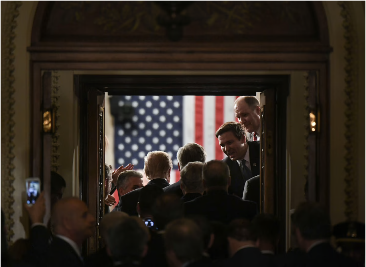 Ron DeSantis, then a congressman, greets President Donald Trump as he arrives for his address to Congress on Feb. 28, 2017. (Jabin Botsford/The Washington Post)