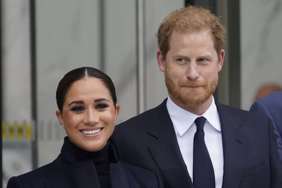 Meghan Markle and Prince Harry pose for pictures after visiting the observatory in One World Trade in 2021. (Seth Wenig / Associated Press)