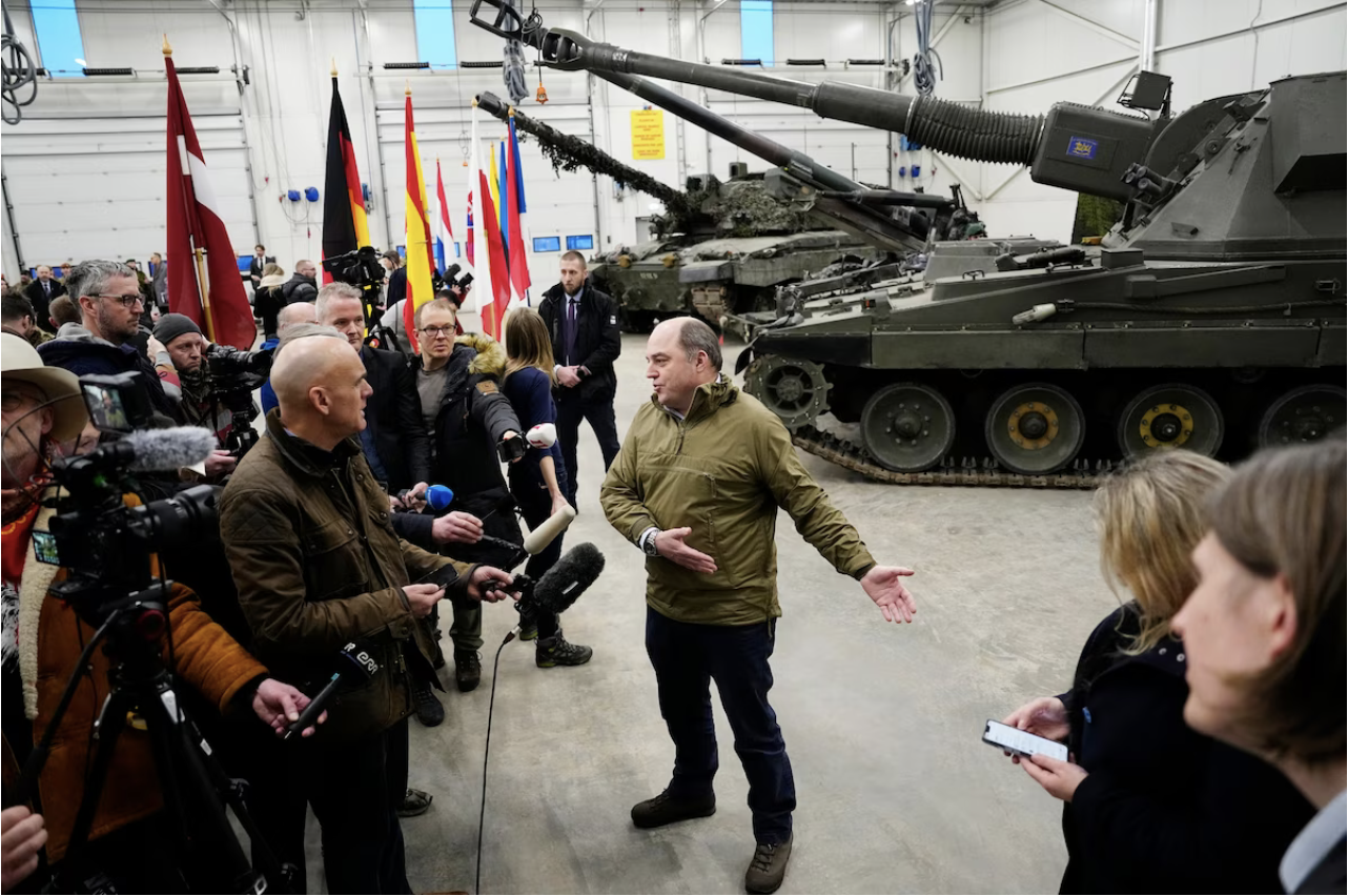 British Defense Secretary Ben Wallace speaks with the media during a visit to a military base in Estonia in January. (Pavel Golovkin/AP)