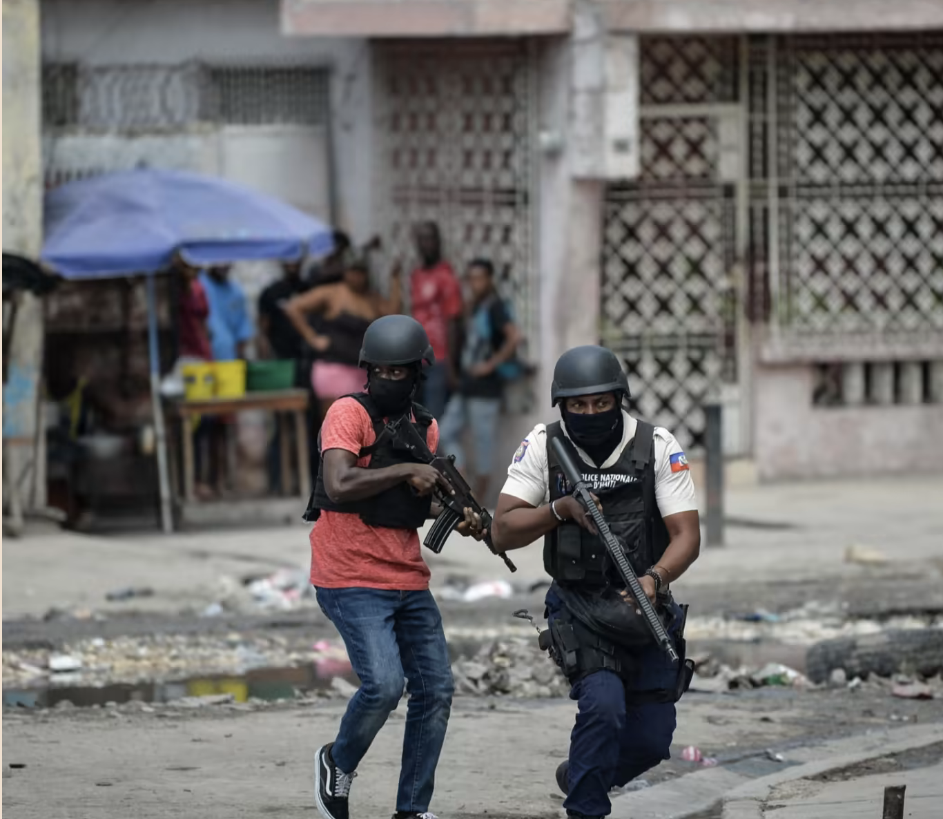 Armed police in action in Port-au-Prince to combat criminal gangs: many nations are wary of becoming involved in a crisis-racked country with deep-rooted problems © Richard Pierrin/AFP/Getty Images