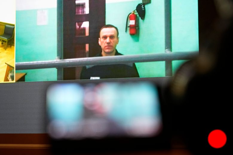 Russian opposition leader Alexei Navalny, on a TV screen during a June court hearing, says the charges against him are trumped up. PHOTO: ALEXANDER ZEMLIANICHENKO/ASSOCIATED PRESS