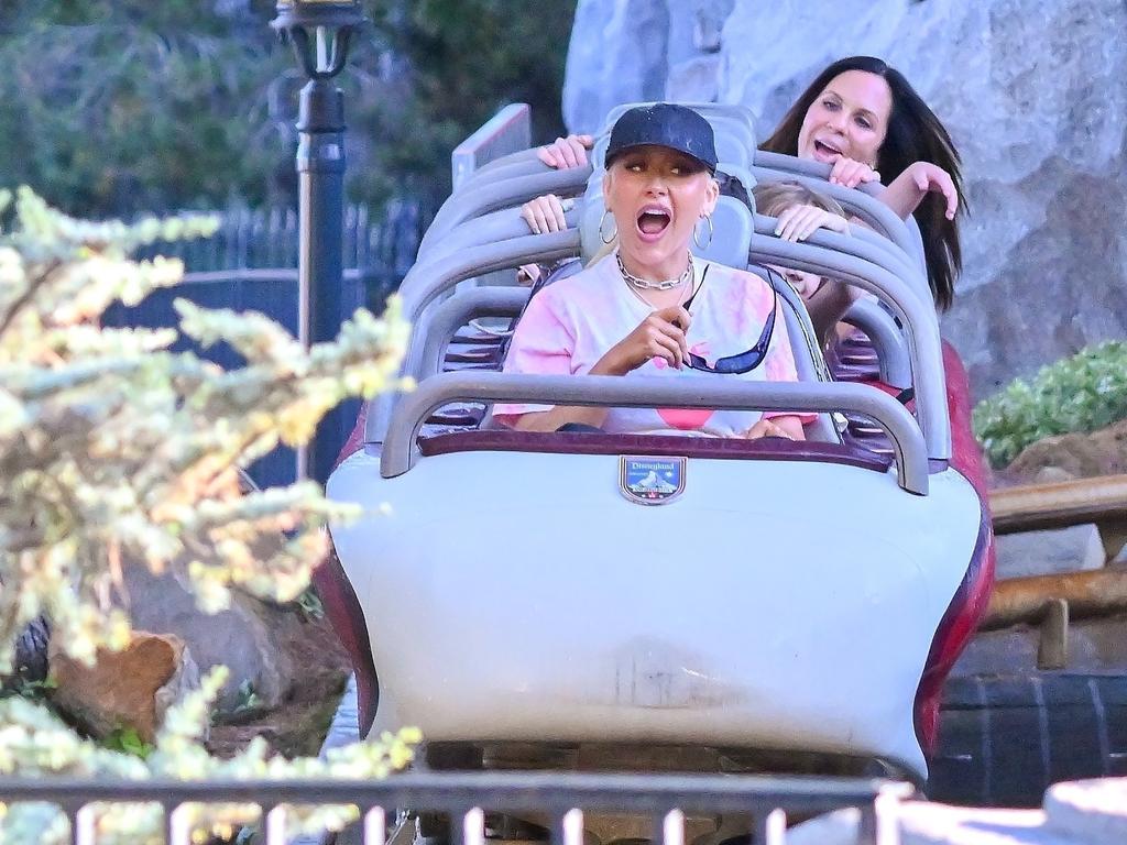 Aguilera’s injury did not stop her from hopping on the rides. Picture: Backgrid