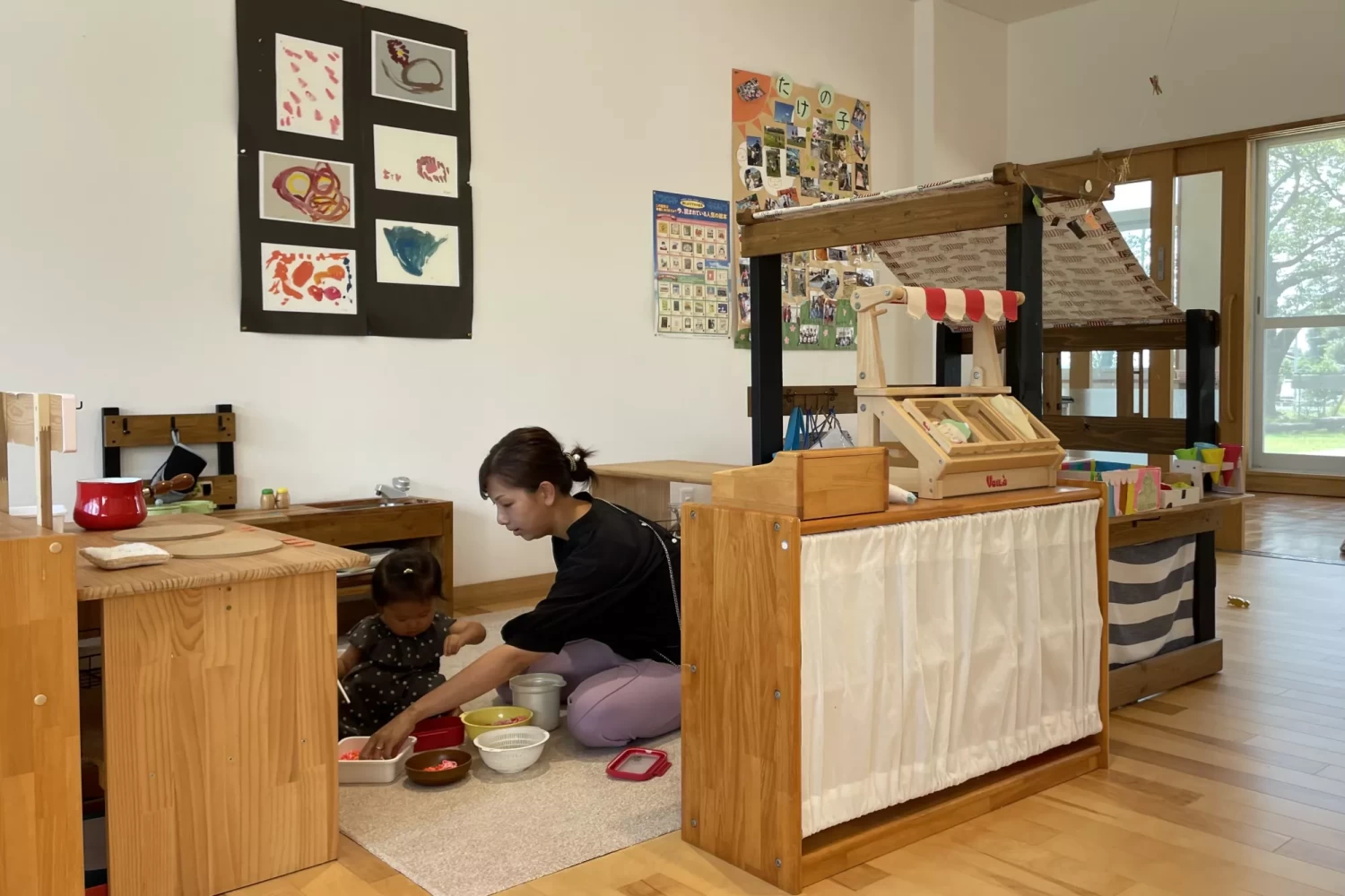 A woman plays with her 18-month-old daughter in Nagi, Japan, where nearly half of local households have three or more children.(Stephanie Yang / Los Angeles Times)
