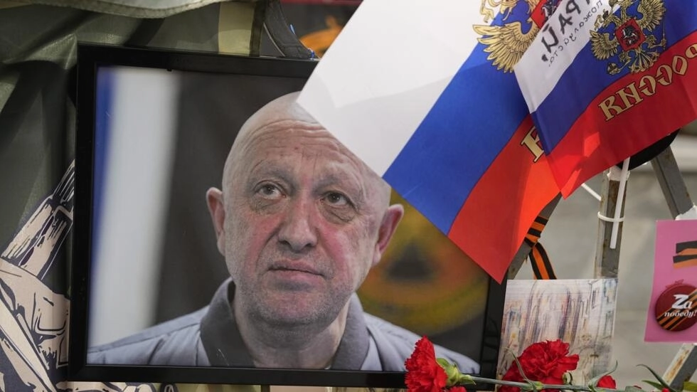 A portrait of the owner of private military company Wagner Group Yevgeny Prigozhin lays at an informal street memorial near the Kremlin in Moscow, Russia, Saturday, August 26, 2023. © Alexander Zemlianichenko, AP