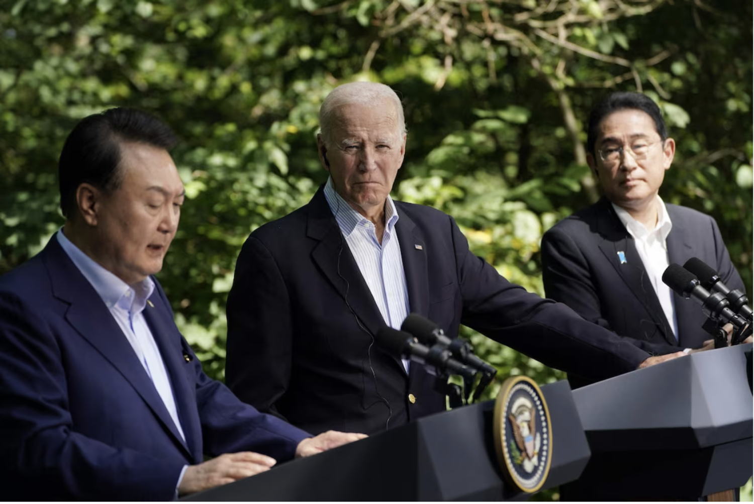 South Korean President Yoon Suk Yeol, President Biden and Japanese Prime Minister Fumio Kishida speak during a news conference at the Camp David Trilateral Summit on Aug. 18. (Kent Nishimura/AFP/Getty Images)