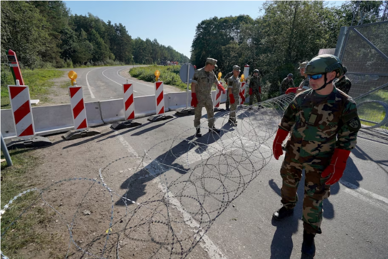 Lithuania installed razor wire last week in Sumskas, on its border with Belarus. The U.S. Embassy warned that avenues for leaving Belarus could become more limited. (Janis Laizans/Reuters)