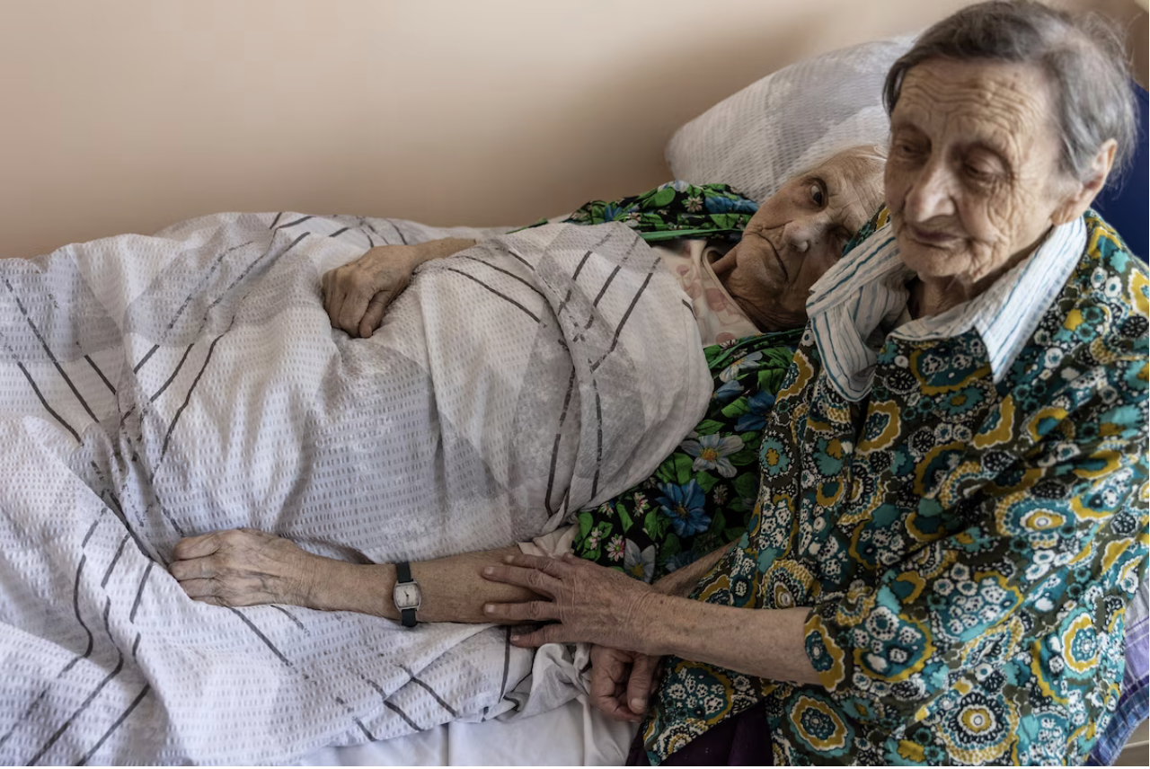 Sisters Hanna and Valentina Lobanova at a shelter in Kharkiv. (Heidi Levine for The Washington Post)