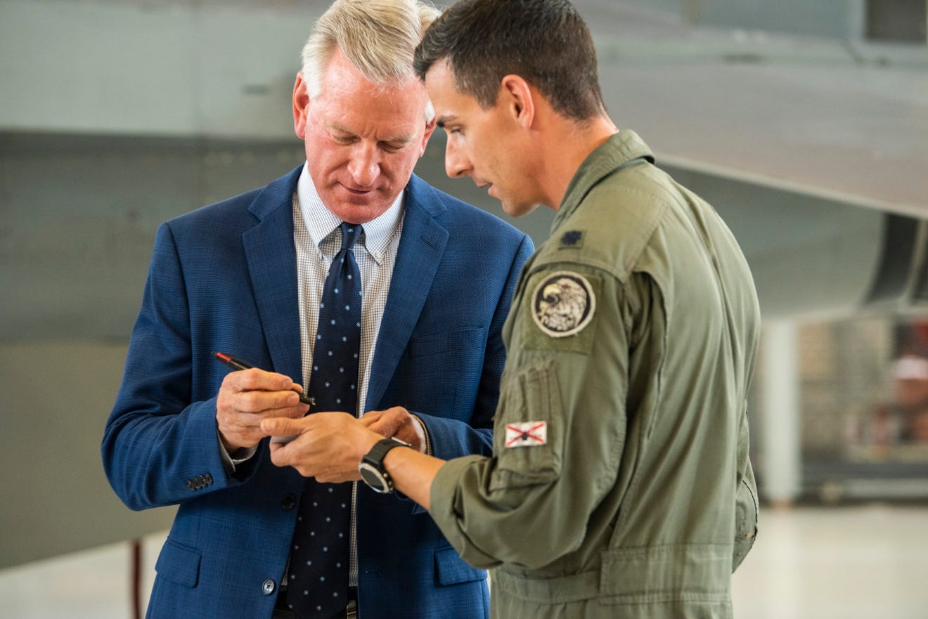 Sen. Tommy Tuberville signs an autograph for Lt. Col. Brian Miller as he visits the 187th Fighter Wing at Dannelly Field in Montgomery, Ala., on Thursday, June 3, 2021. Jake Crandall/ Advertiser