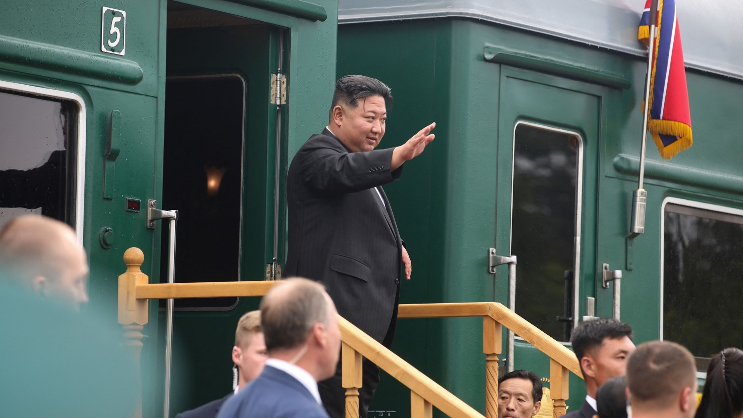 Government of Russia's Primorsky Krai/Handout/Reuters. North Korean leader Kim Jong Un waves as he boards his train at a railway station in the town of Artyom to leave Russia on Sunday.
