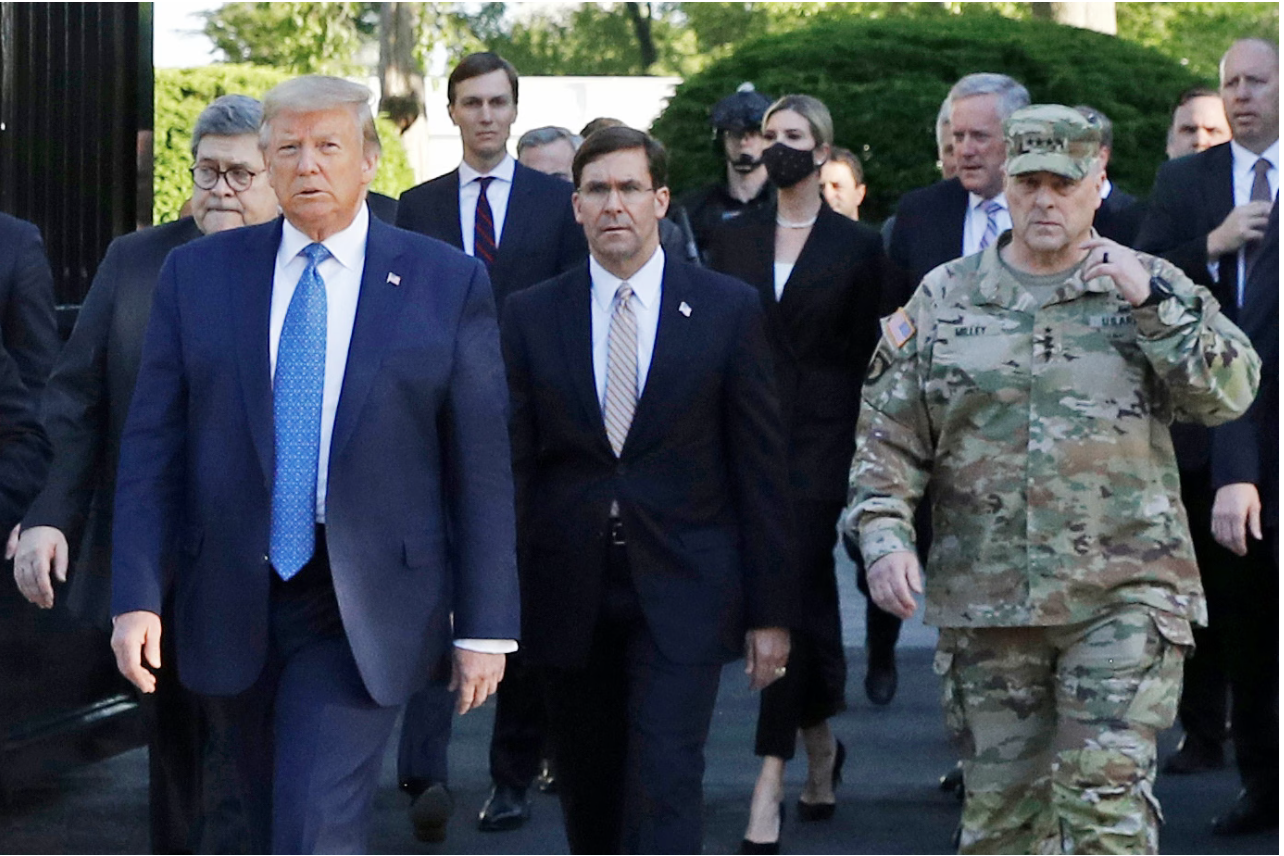 President Donald Trump leads aides, including Attorney General William P. Barr, Defense Secretary Mark T. Esper and Gen. Mark A. Milley, across Lafayette Square on June 1, 2020, to St. John's Church. (Patrick Semansky/AP)