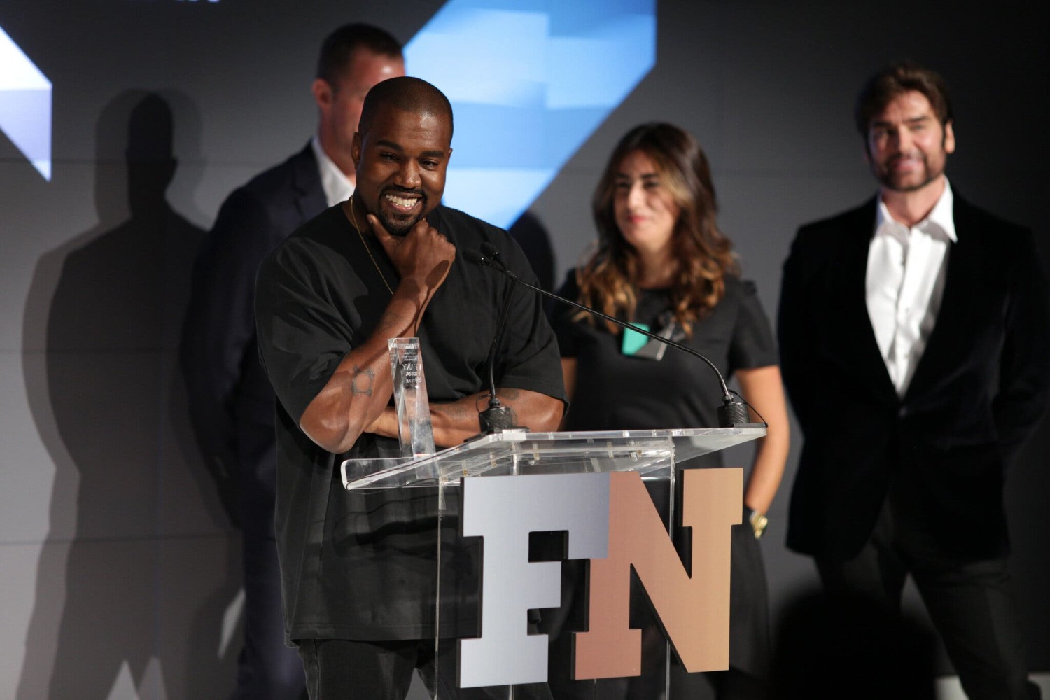 Mr. West accepting the Shoe of the Year prize for the Yeezy Boost 350 at the 2015 Footwear News Achievement Awards.Credit...Patrick MacLeod/WWD/Penske Media, via Getty Images