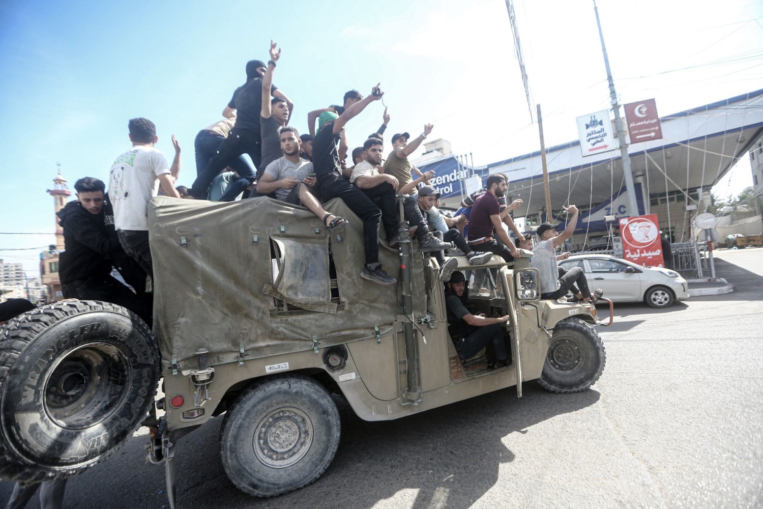 Palestinians in Gaza City commandeered an Israeli military vehicle on Saturday. MOHAMMED TALATENE/ZUMA PRESS