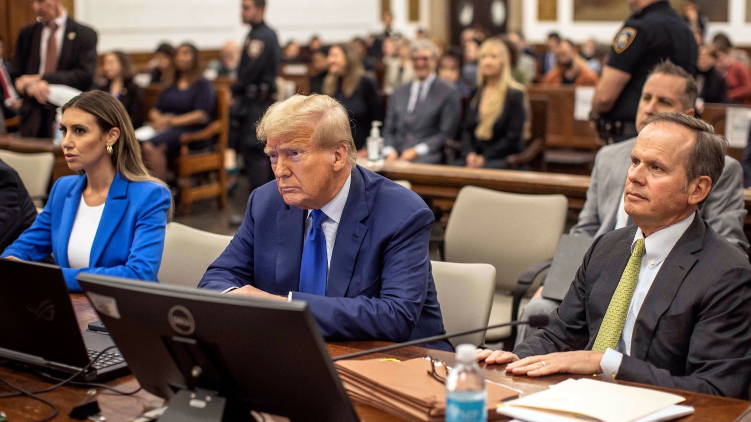 Former President Donald Trump center and his lawyers Christopher Kise right and Alina Habba wait for the continuation of his civil business fraud trial at New York Supreme Court on Wednesday Oct. 25 2023 in New York. Dave Sanders/The New York Time