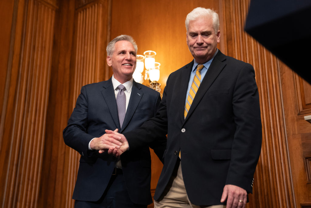 House Speaker Kevin McCarthy and Rep. Tom Emmer, the majority whip, shake hands following passage in the House of a 45-day continuing resolution on September 30, 2023 in Washington, DC. Nathan Howard—Getty Images