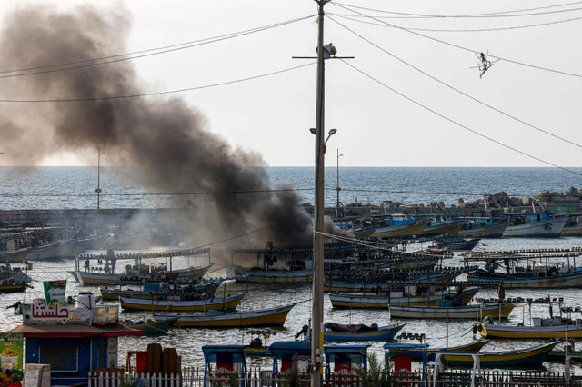 A plume of smoke rises above the port in the Gaza Strip after an Israeli air strike on Sunday / AFP via Getty Images