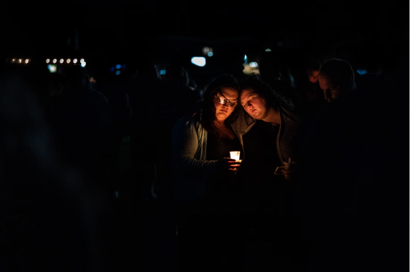 People gather for a vigil Saturday in Lisbon, Maine, days after a gunman killed 18 people in neighboring Lewiston. (Salwan Georges/The Washington Post)