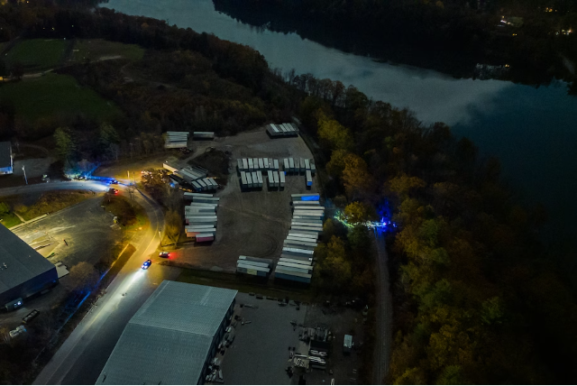 Law enforcement personnel investigate the site in Lisbon where the body of the Lewiston shooter was found Friday. (Salwan Georges/The Washington Post)