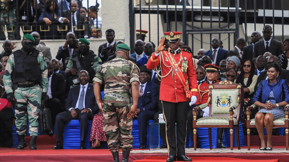 File photo: Gabon's new strongman General Brice Oligui Nguema salutes as his wife Zita Nyangue Oligui Nguema looks on during the military parade, in Libreville on September 4, 2023. © AFP