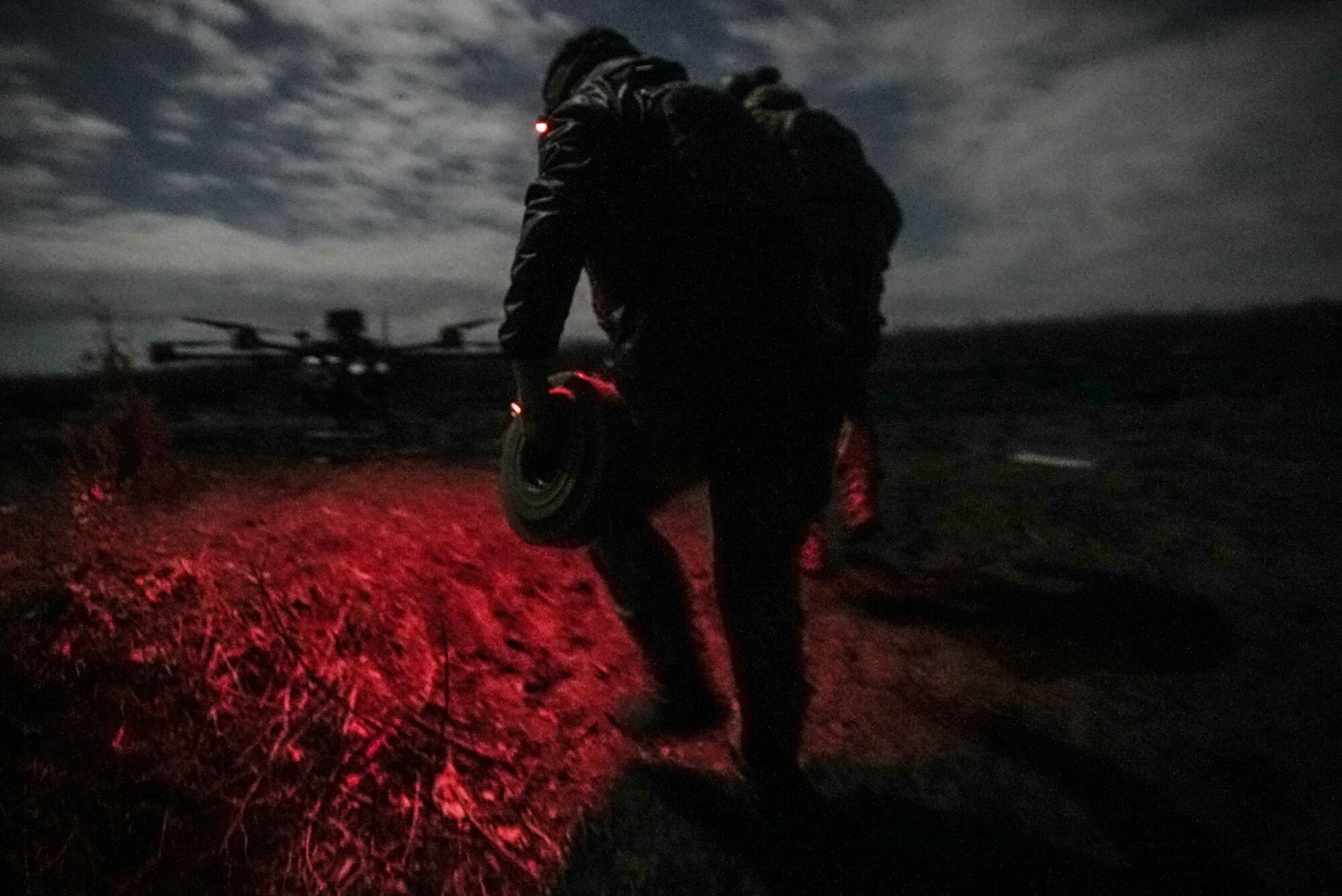 Fixing the drop on a Vampire drone during a night mission with the Code 9.2 unit at the front line near Bakhmut, Donetsk region, Ukraine, on Oct. 28.Photographer: Julia Kochetova