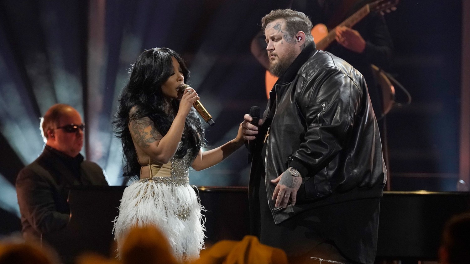 K. Michelle, left, and Jelly Roll perform "Love Can Build a Bridge" at the 57th Annual CMA Awards on Wednesday. George Walker IV/Invision/AP