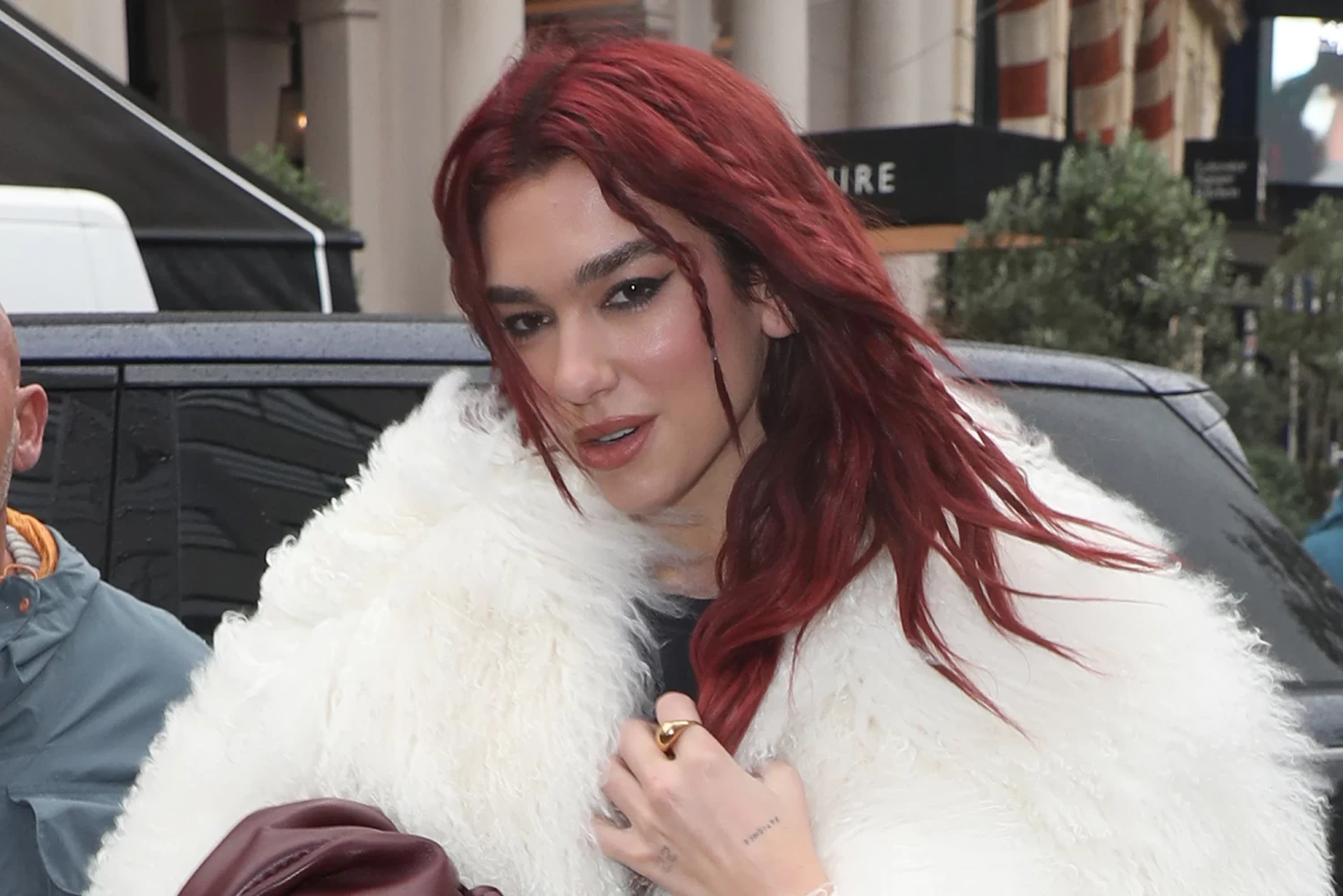 Dua Lipa is the latest celebrity to debut cherry-colored tresses this autumn. Neil Mockford/GC Images/Getty Images