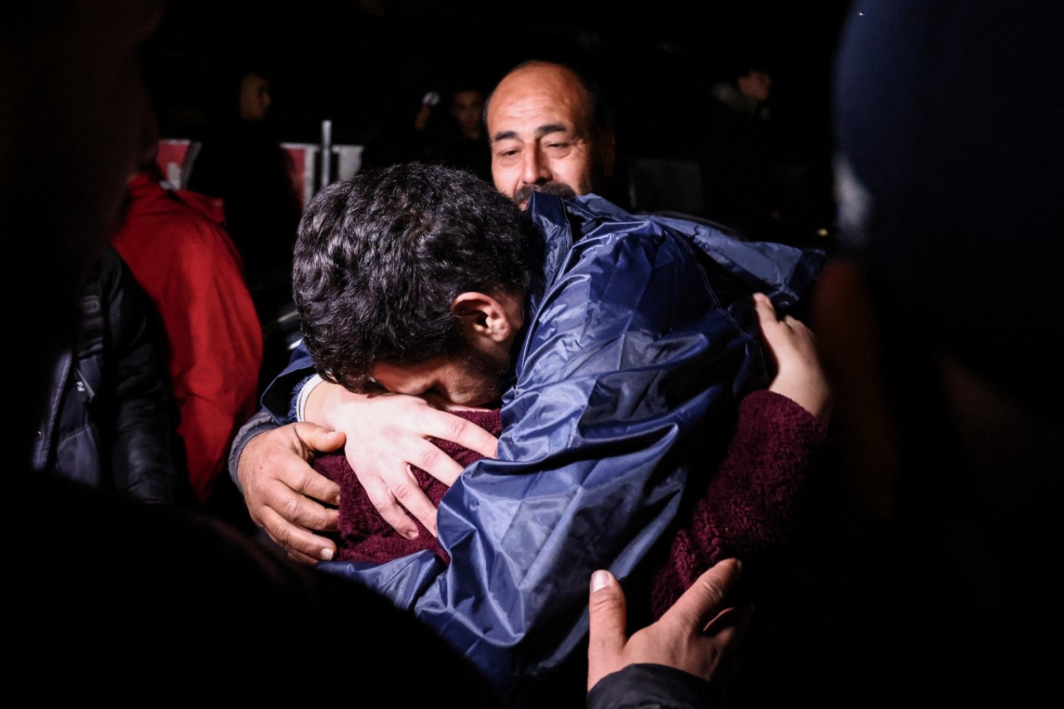 A Palestinian prisoner hugs his relatives after being released from an Israeli jail in exchange for Israeli hostages. KENZO TRIBOUILLARD/AFP/GETTY IMAGES