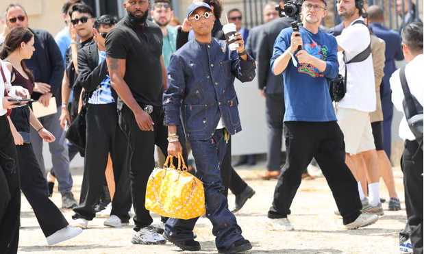Pharrell Williams, Louis Vuitton’s creative director, was spotted carrying the bag at Paris fashion week over the summer. Photograph: Jacopo Raule/Getty Images