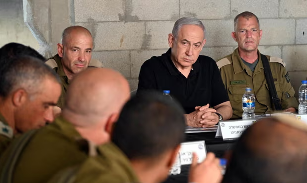 Israeli prime minister Benjamin Netanyahu meets with soldiers at an army base in Tze'elim on Tuesday. Photograph: GPO/Haim Zach/Reuters