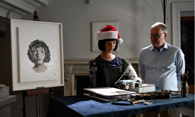 Mike Wooldridge with the robot Ai-Da ahead of the Royal Institution Christmas lectures. Photograph: Kate Green/Getty Images