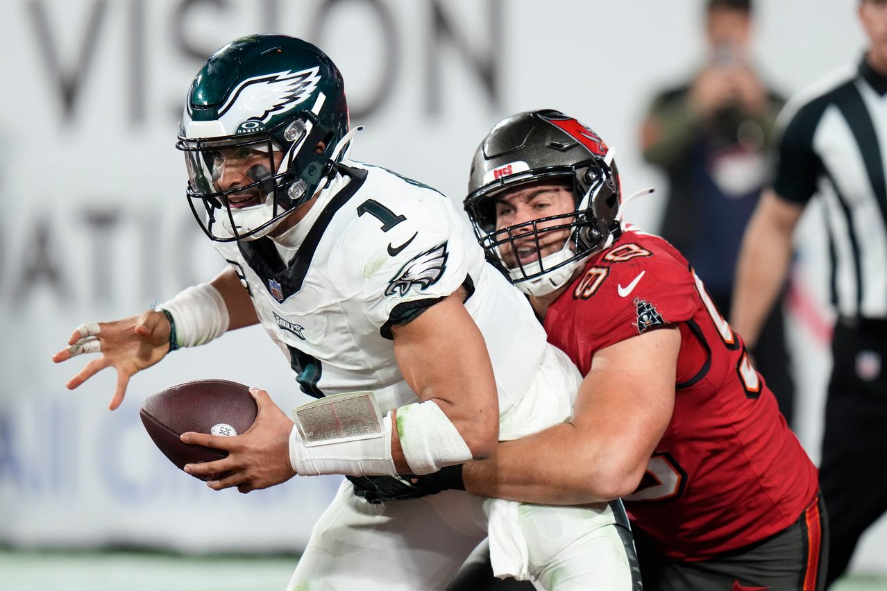 Philadelphia Eagles quarterback Jalen Hurts was sacked for a safety in the end zone by Tampa Bay Buccaneers linebacker Anthony Nelson. CHRIS O’MEARA/ASSOCIATED PRESS