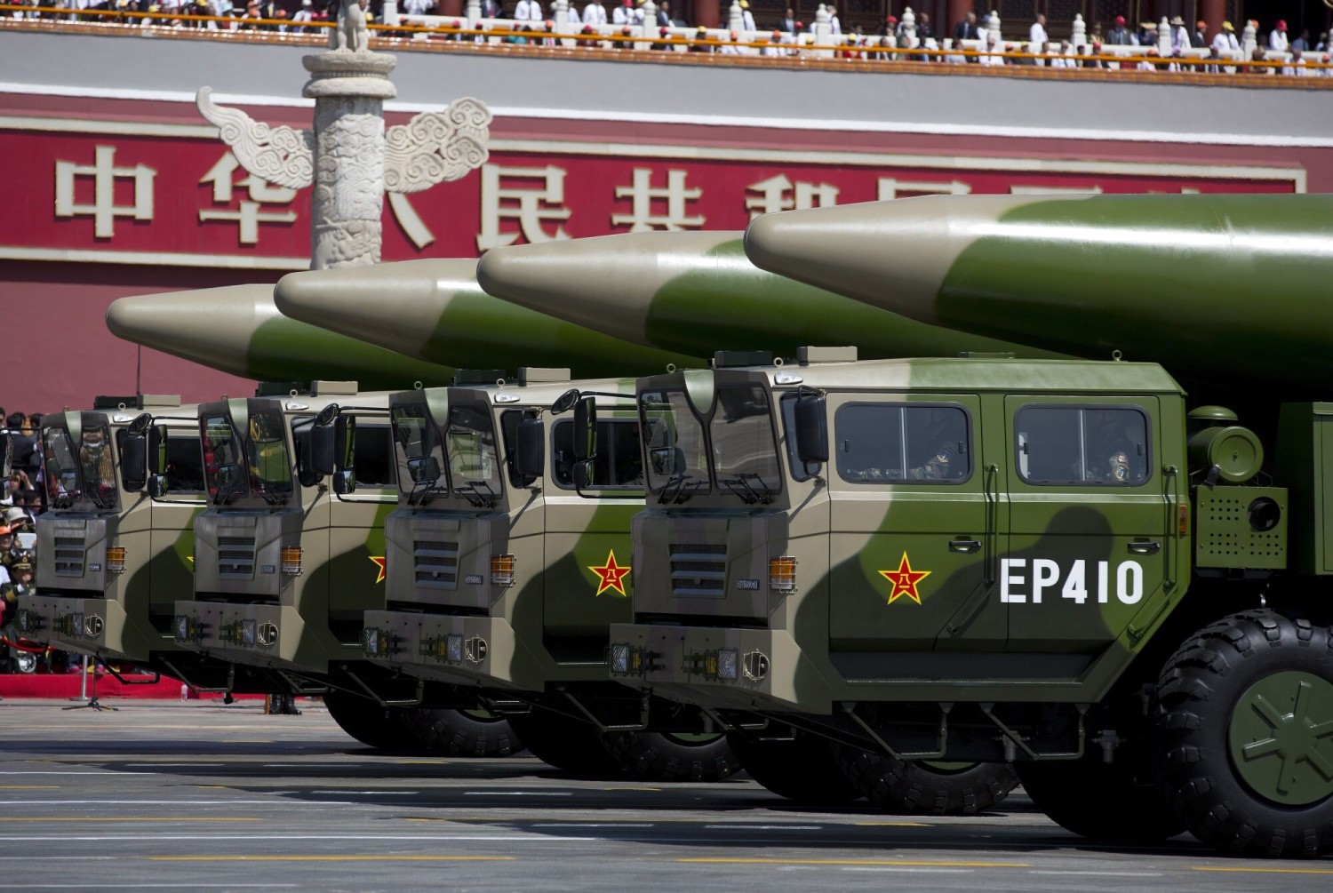 Military vehicles carrying missiles, drive past the Tiananmen Gate.Photographer: Pool/Getty Images