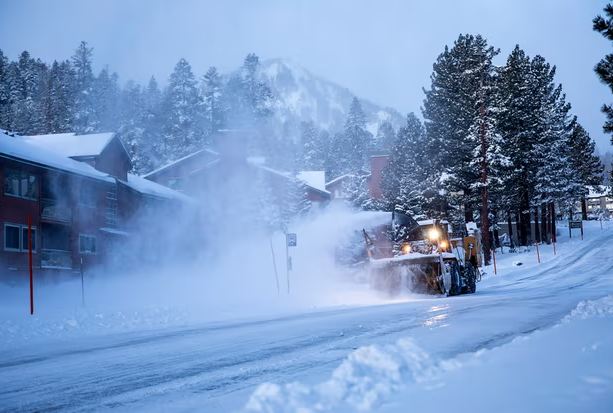 A snow plow clears a road in Mammoth Lakes, California, on 3 January 2024. More snow is forecast for the Sierra Nevada mountains. Photograph: Samantha Lindberg/AP