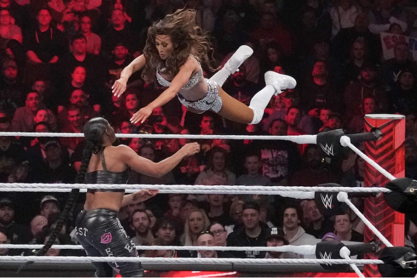 Carmella leaps at Bianca Belair during World Wrestling Entertainment’s “Raw,” on March 6 in Boston. (Charles Krupa/AP)