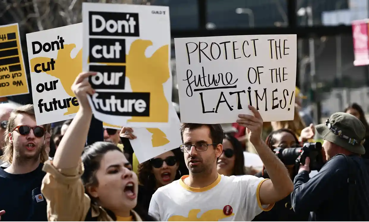 Los Angeles Times Guild journalists rally in front of City Hall to protest against layoffs on 19 January 2024. Photograph: Patrick T Fallon/AFP/Getty Images