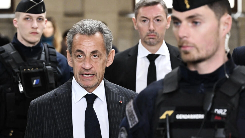 Former French president Nicolas Sarkozy (C-L) arrives for the verdict in his appeal trial in the so-called Bygmalion case at the courthouse in Paris, France on February 14, 2024. © Bertrand Guay, AFP